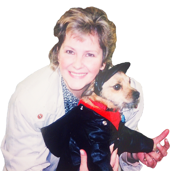 The company owner holding her dog, Teddy